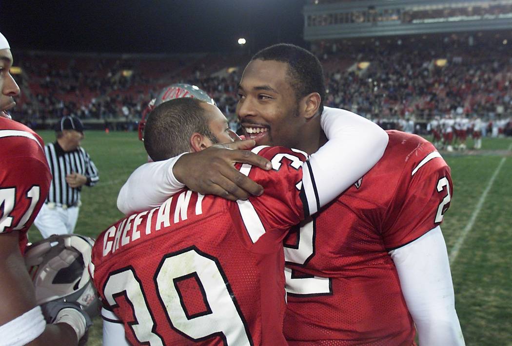 UNLV kicker/punter Ray Cheetany, left, gets a hug from quarterback Jason Thomas in the final mi ...