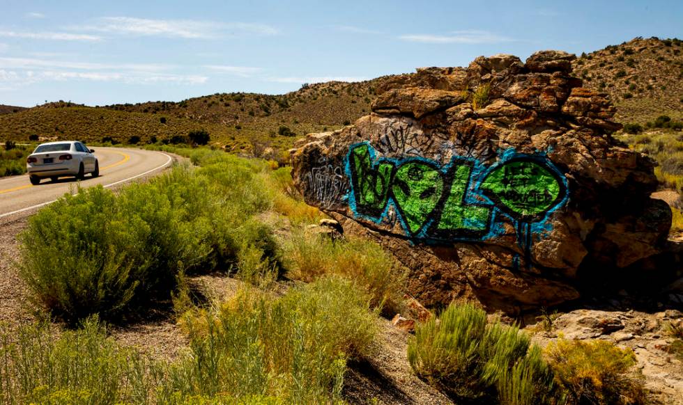 A rock is painted with an alien along the Extraterrestrial Highway/state Route 375 sits between ...