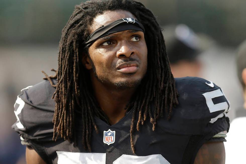 Former Oakland Raiders outside linebacker Neiron Ball (58) stands on the sideline during the se ...