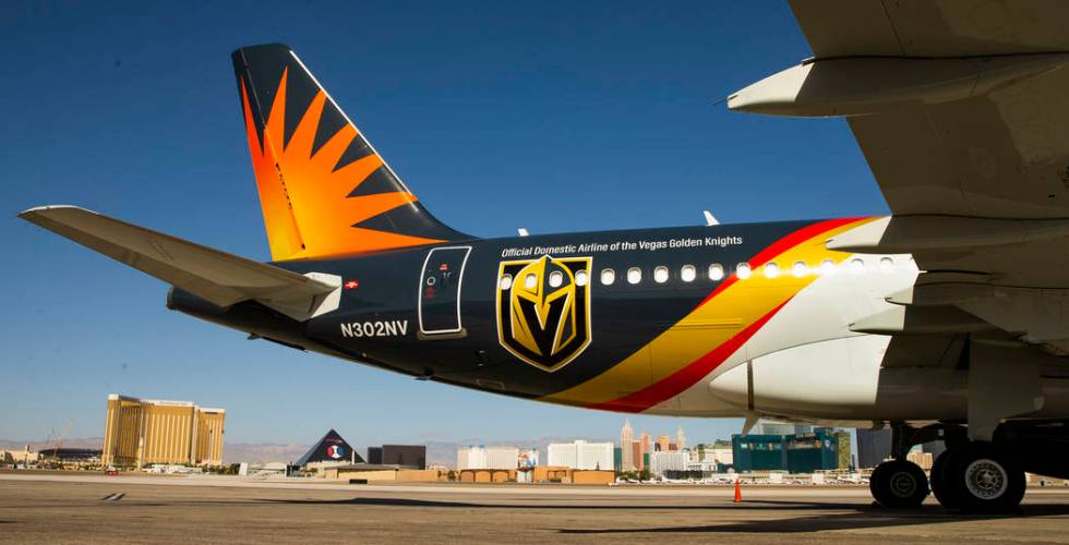 Team markings adorn the plane as Allegiant unveils a new Golden Knights-themed plane at McCarra ...