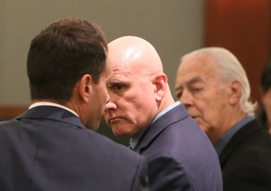 Las Vegas Metro Police officer, Lt. James Melton, center, appears in court at the Regional Just ...