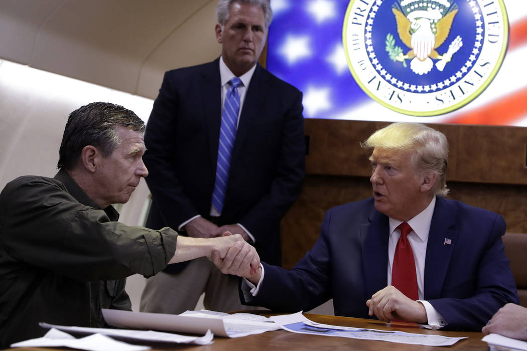President Donald Trump participates in a briefing with North Carolina Gov. Roy Cooper about Hur ...