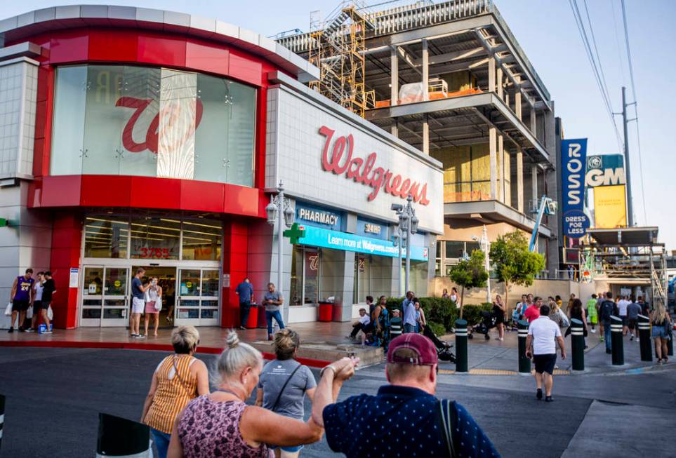 People walk by the Walgreens on the Las Vegas Strip on Tuesday, Sept. 10, 2019, in Las Vegas. T ...