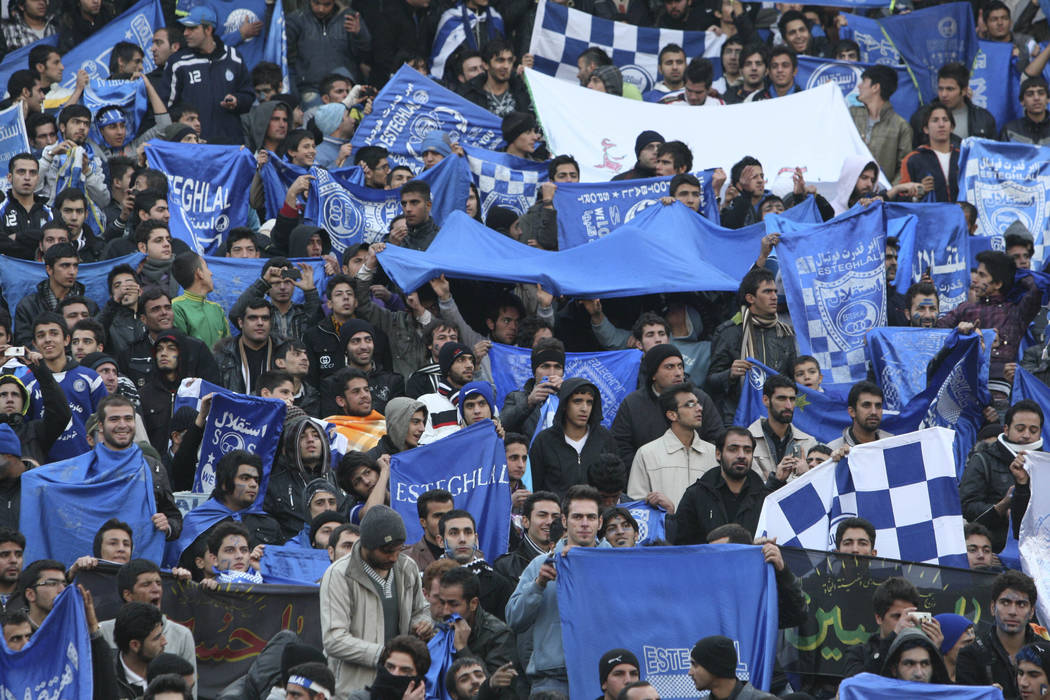 FILE - In this Dec. 9, 2011 file photo, supporters of Iranian soccer team Esteghlal, hold flag ...