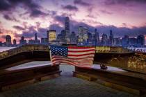 A U.S. flag hanging from a steel girder, damaged in the Sept. 11, 2001 attacks on the World Tra ...
