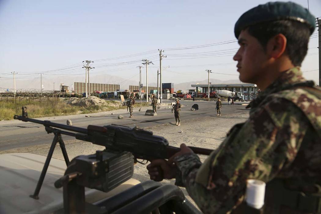 In this Tuesday, Sept. 10, 2019, photo, Afghan National Army soldiers stand guard at a checkpoi ...