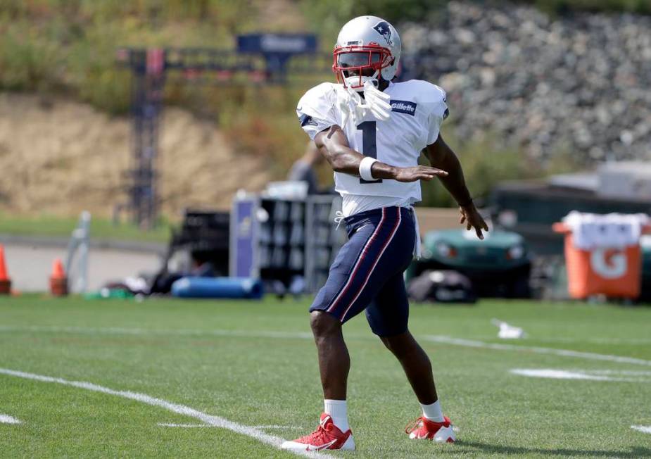 New England Patriots wide receiver Antonio Brown works out during NFL football practice, Wednes ...