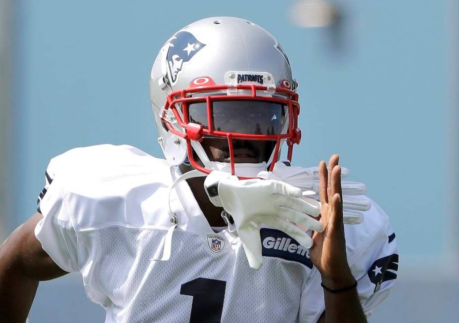 New England Patriots wide receiver Antonio Brown works out during NFL football practice, Wednes ...