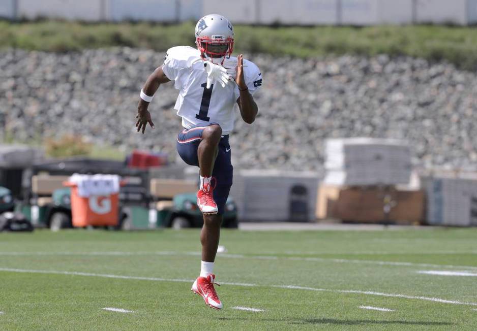 New England Patriots wide receiver Antonio Brown works out during NFL football practice, Wednes ...