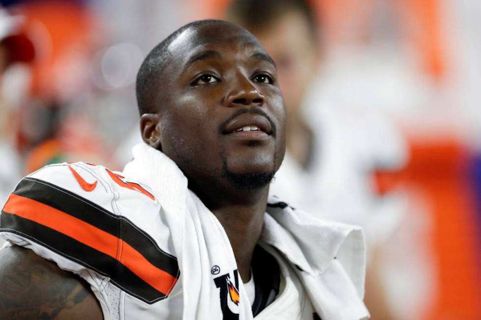 Cleveland Browns defensive end Chris Smith (50) sits on the sideline during the first half of a ...