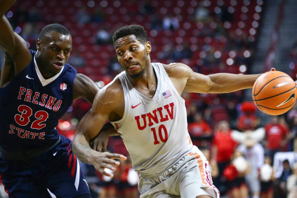 UNLV Rebels forward Shakur Juiston (10) drives against Fresno State Bulldogs forward Nate Grime ...