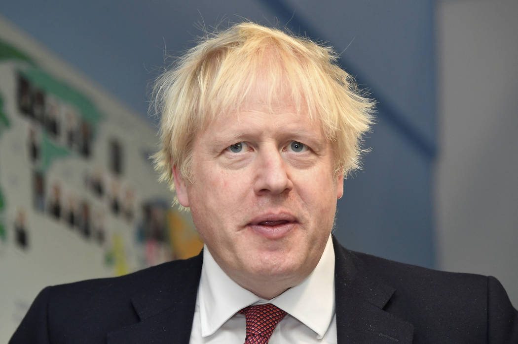 Britain's Prime Minister Boris Johnson visits Pimlico Primary school in London, Tuesday July 10 ...