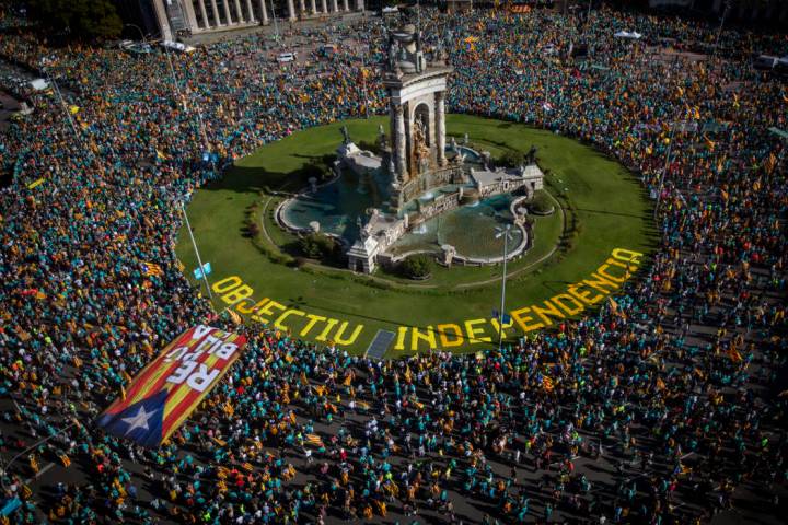 Protesters hold esteladas or independence flags as they take part in a demonstration during the ...
