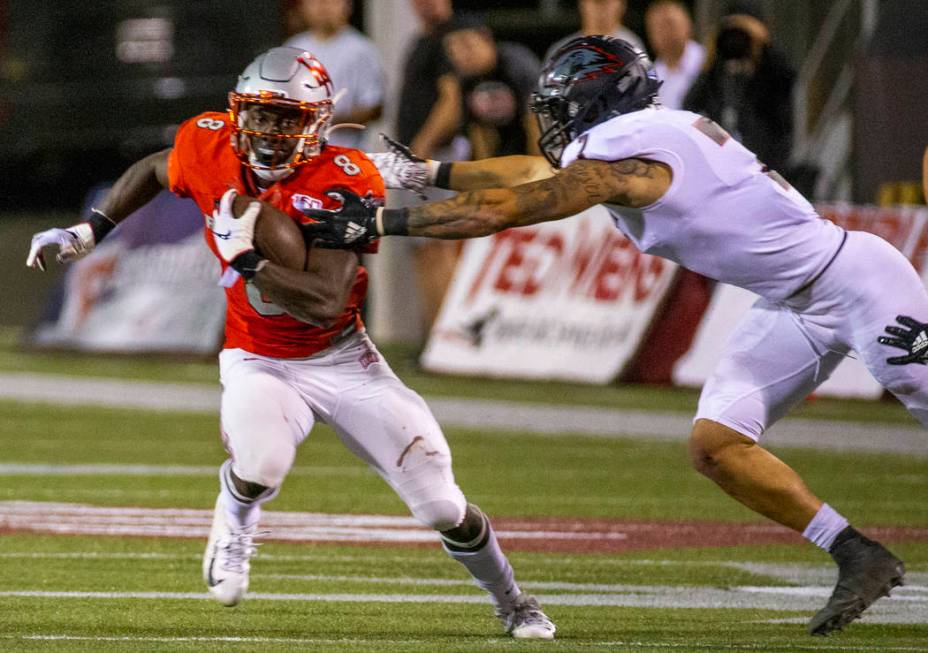 UNLV Rebels running back Charles Williams (8) looks to break a tackle attempt by Southern Utah ...