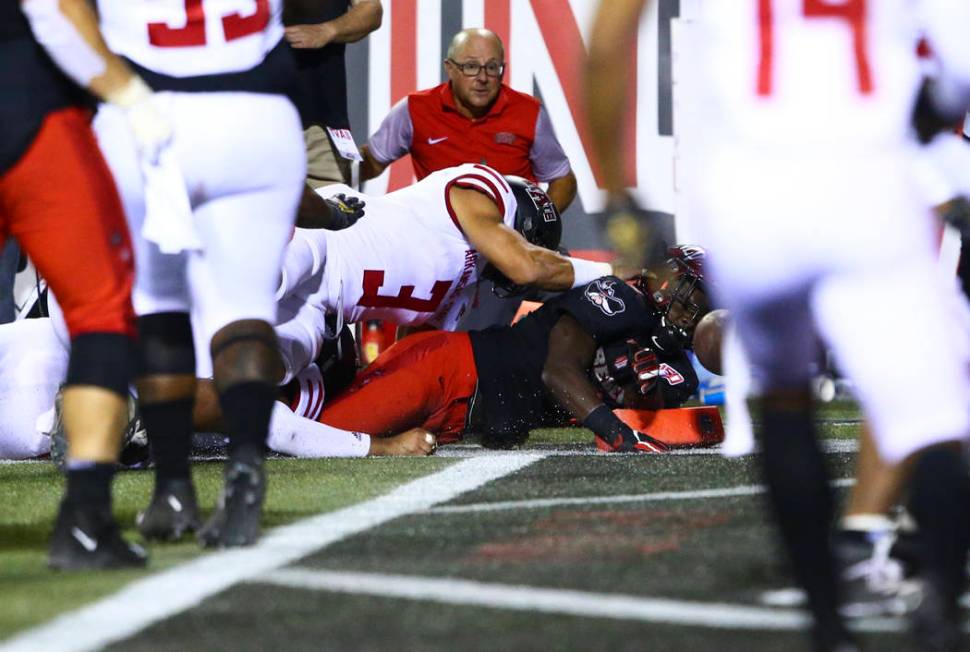UNLV Rebels running back Charles Williams (8) scores a touchdown in front of Arkansas State Red ...