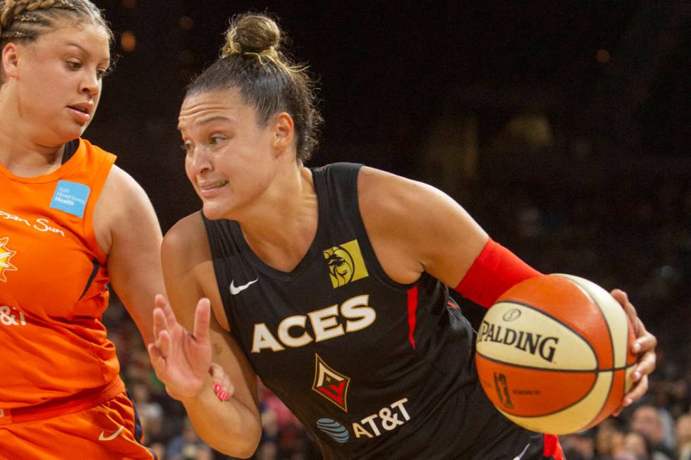 Las Vegas Aces guard Kayla McBride (21) runs to the hoop against Connecticut Sun guard Rachel B ...