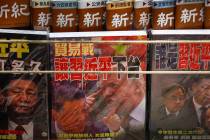 FILE - In this July 4, 2019, file photo, magazines with a front cover featuring Chinese Preside ...
