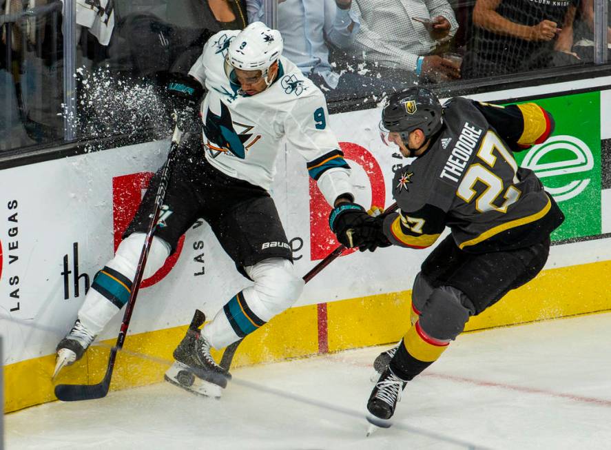 San Jose Sharks left wing Evander Kane (9) crashes the boards with Golden Knights defenseman Sh ...