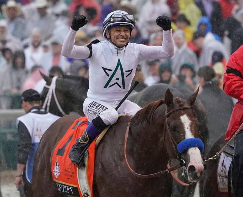 Mike Smith celebrates after riding Justify to victory during the 144th running of the Kentucky ...