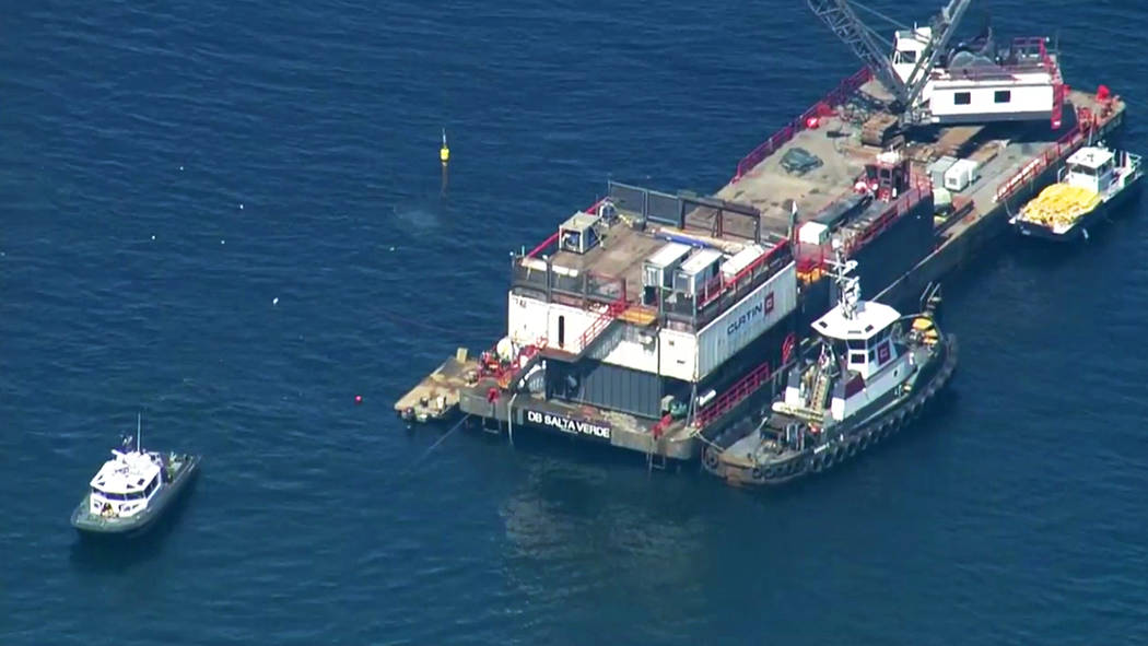 This photo from video provided by KABC-TV shows divers resuming their search for the final miss ...