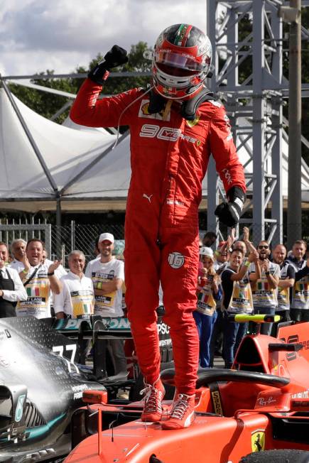 Ferrari driver Charles Leclerc of Monaco celebrates after winning the Formula One Italy Grand P ...