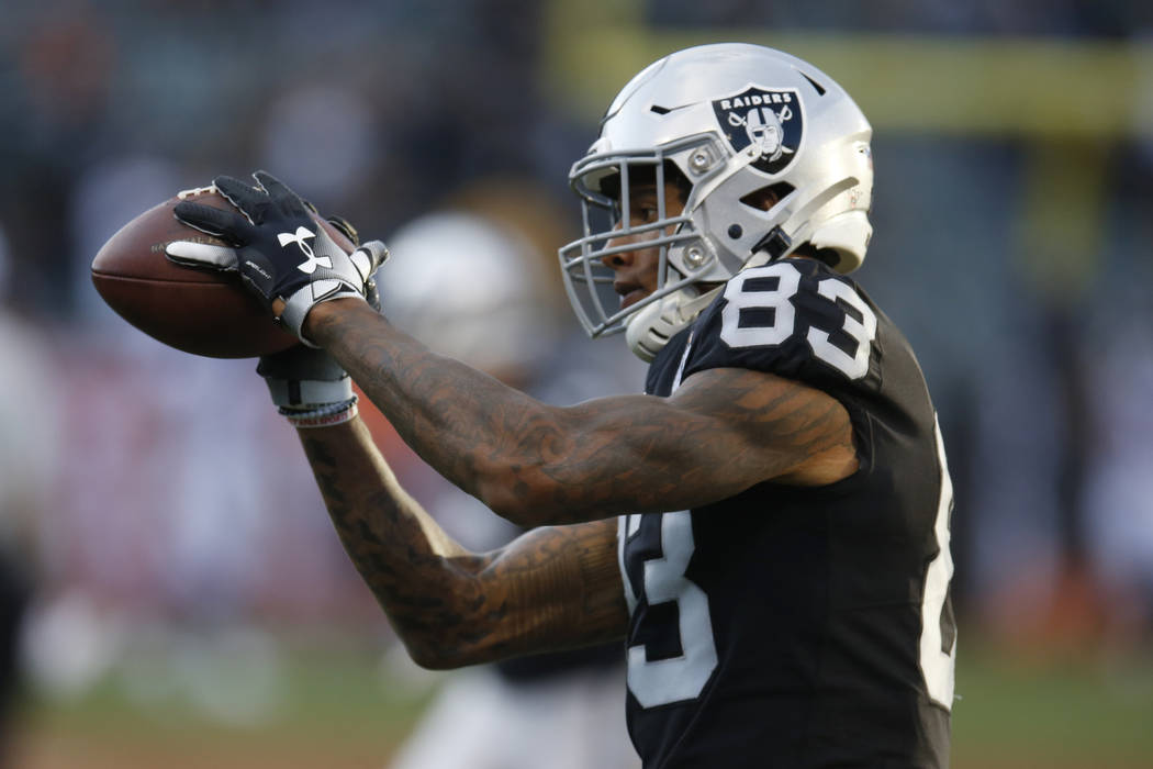 Oakland Raiders tight end Darren Waller warms up before an NFL football game against the Denver ...