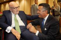 Former U.S. Sen. Harry Reid, left, talks with former Nevada Gov. Brian Sandoval before the Neva ...