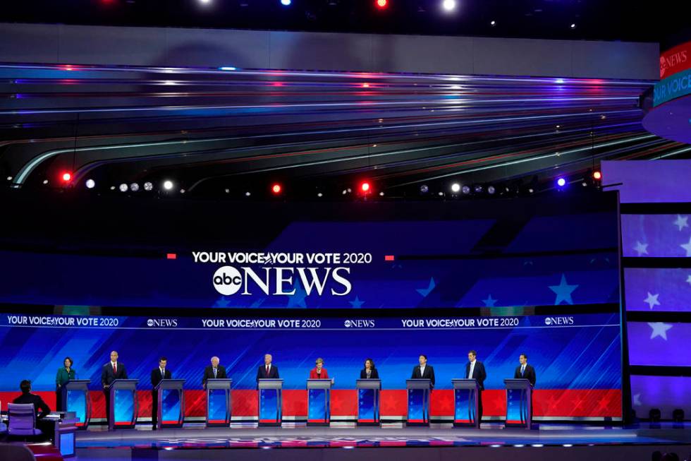 From left, Democratic presidential candidates Sen. Amy Klobuchar, D-Minn., Sen. Cory Booker, D- ...