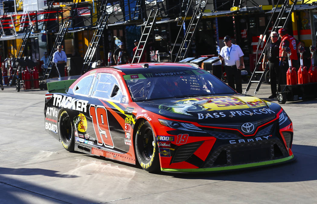 Martin Truex Jr. (19) heads to the track during qualifying for the Monster Energy NASCAR Cup Se ...