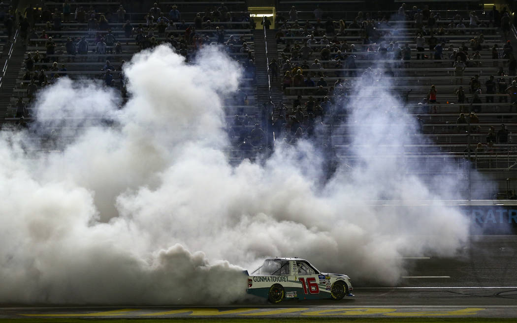 Austin Hill celebrates his win with a burnout at the NASCAR World of Westgate 200 Truck Series ...