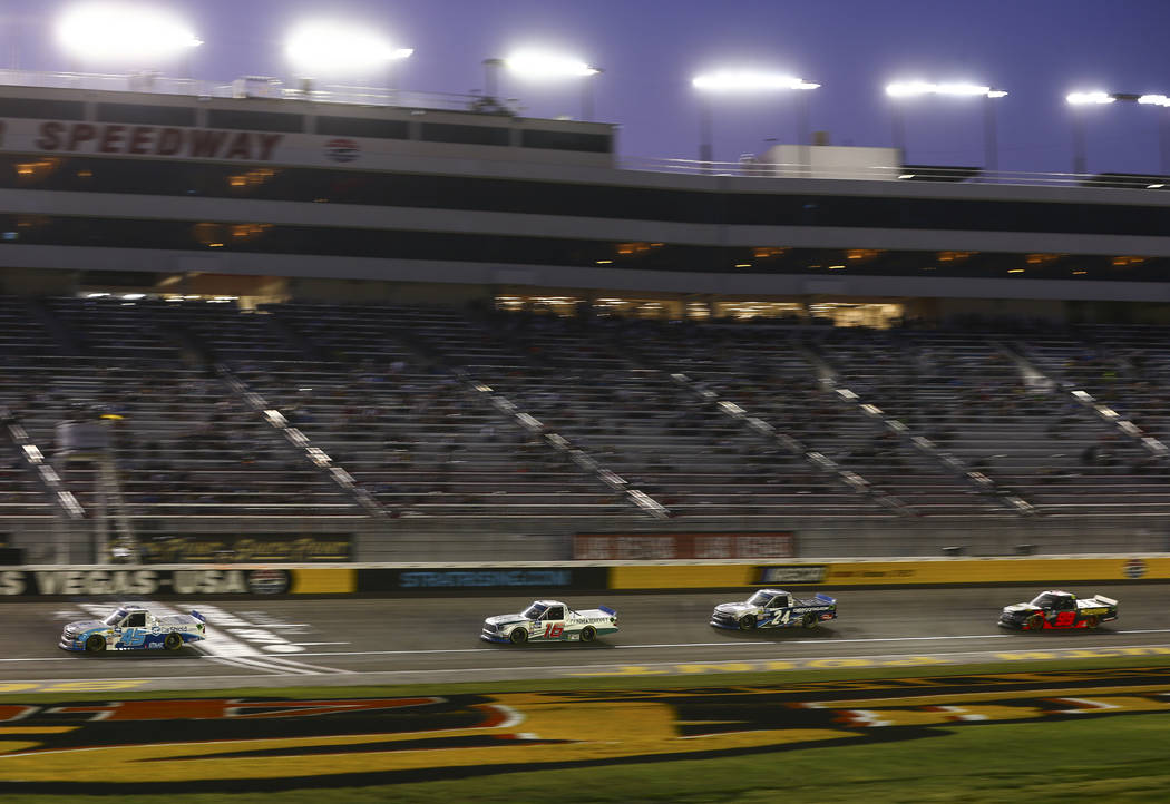 Drivers during a caution while competing in the NASCAR World of Westgate 200 Truck Series auto ...