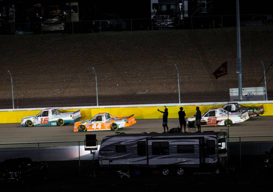 Attendees cheer as drivers compete during the NASCAR World of Westgate 200 Truck Series auto ra ...