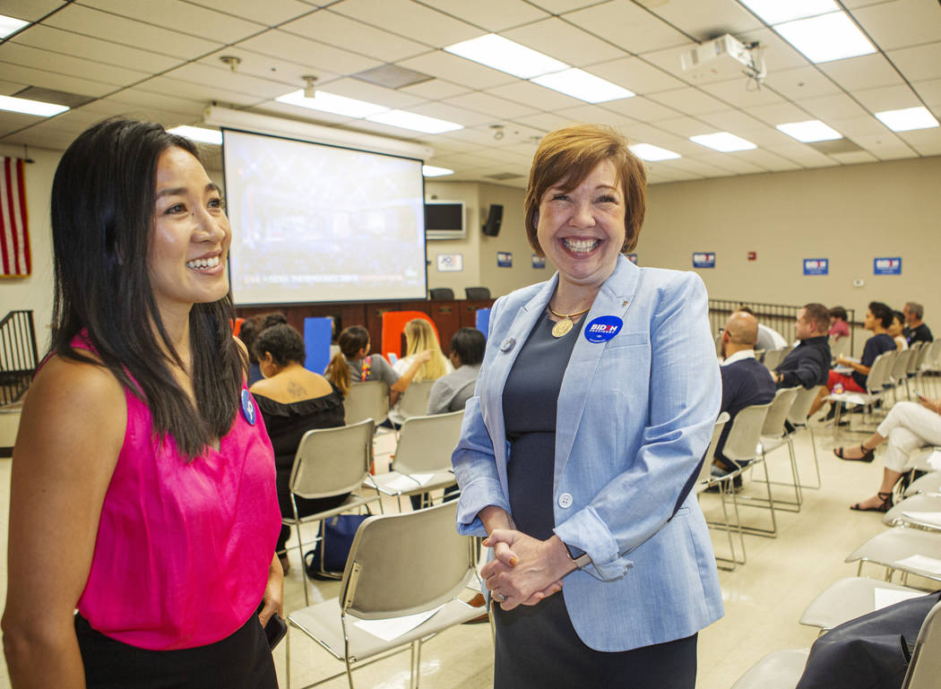 Michelle Kwan, two-time Olympic figure skating medalist, left, talks with Nevada Assemblywoman ...