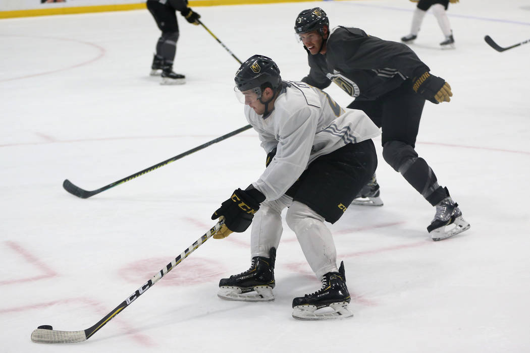 Vegas Golden Knights center Paul Cotter (43) moves with the puck as defenseman Brayden McNabb ( ...