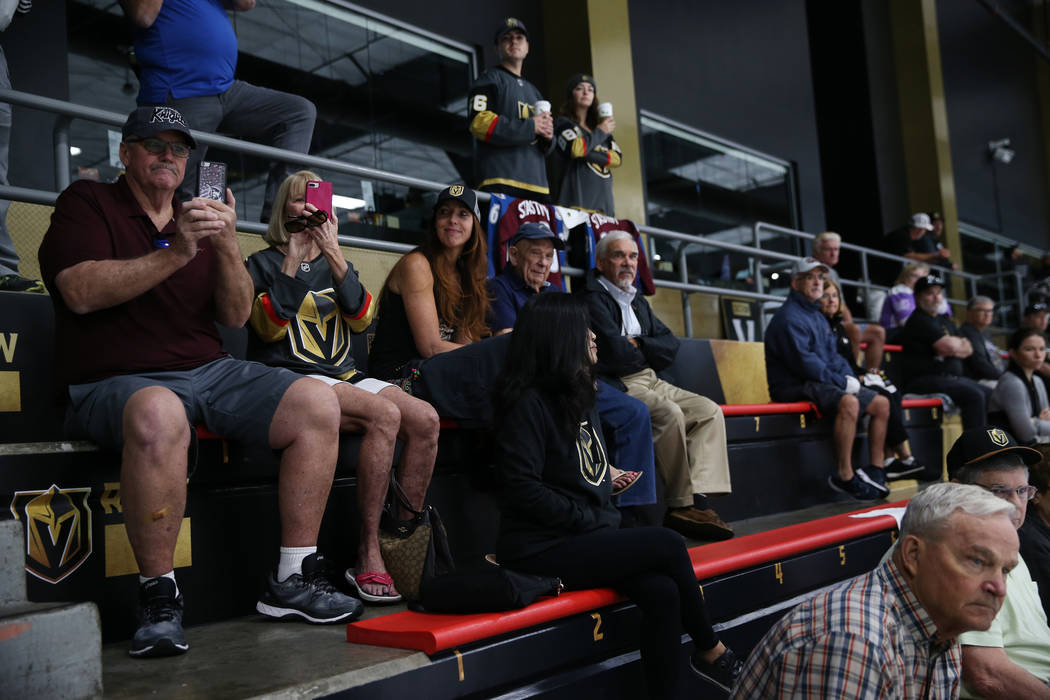 Fans watch the Vegas Golden Knights practice at City National Arena in Las Vegas, Friday, Sept. ...