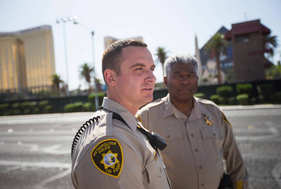 Las Vegas police officer Brandon Engstrom, left, and George Gafford, who works in the Police Em ...