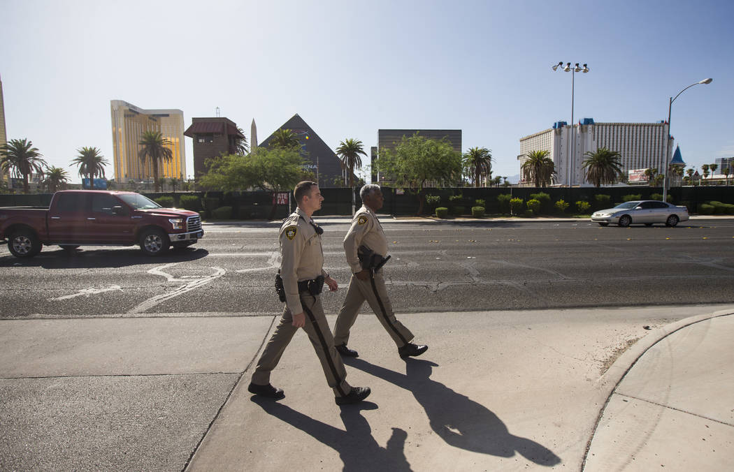 Las Vegas police officer Brandon Engstrom, left, and George Gafford, who works in the Police Em ...