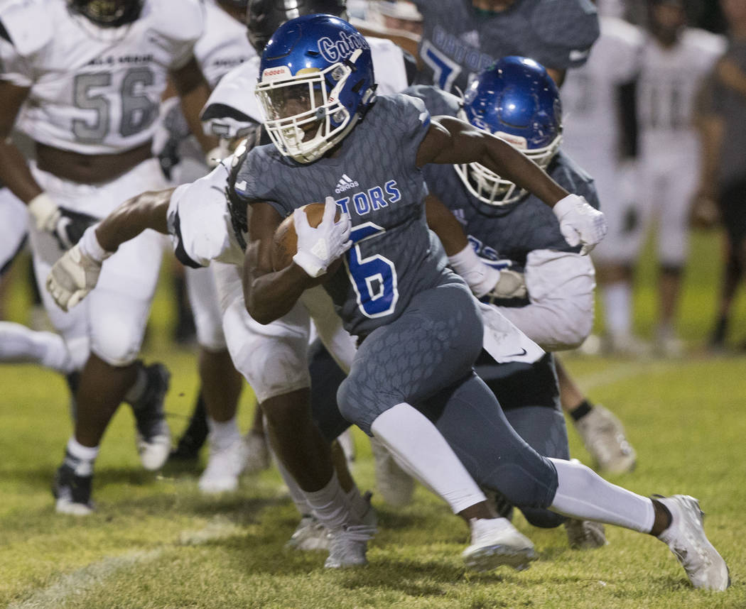 Green Valley senior running back Maaliek Duncan (6) cuts up field in the second quarter during ...