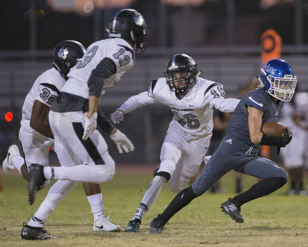 Green Valley senior wide receiver Brady Clayton (4) breaks into the open field past Palo Verde ...