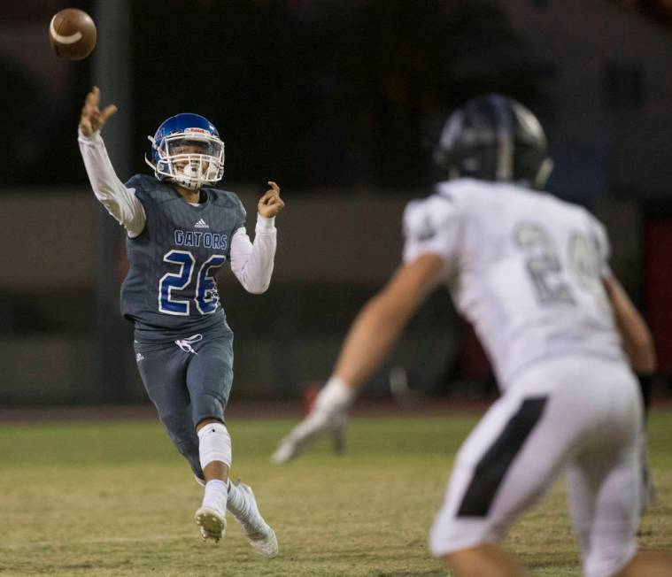 Green Valley freshman quarterback Anton Mazzulo (26) throws towards the sideline with Palo Verd ...