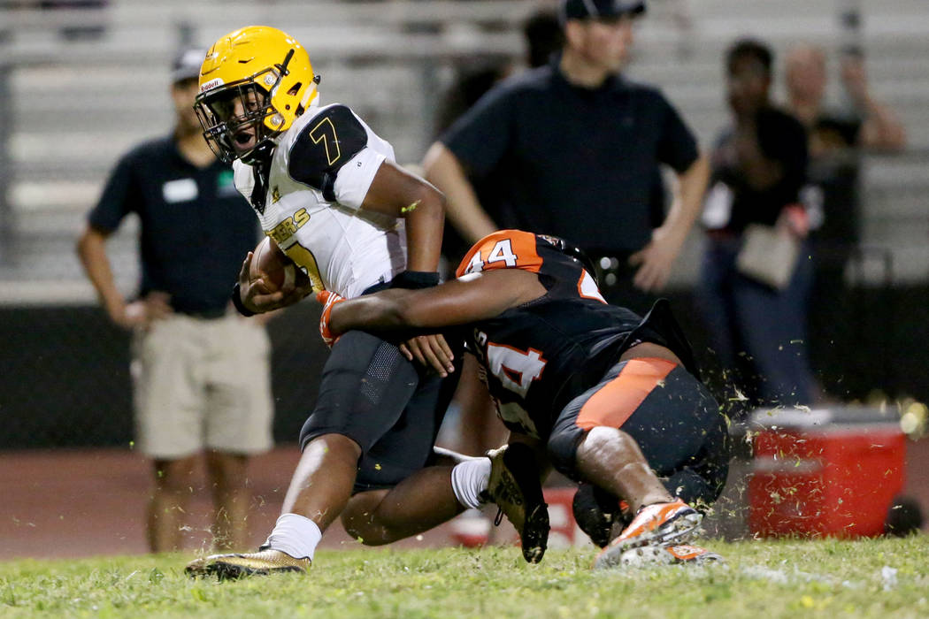 Clark's My'quel Johnson(7) is tackled by Chaparral's Robert Whitstone (44) in the second quarte ...