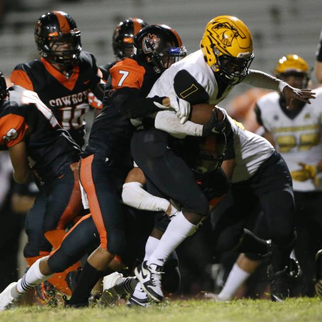 Clark's Elijah Caver (1) runs the ball for a touchdown against Chaparral's Nicholas Gaddy (7) i ...