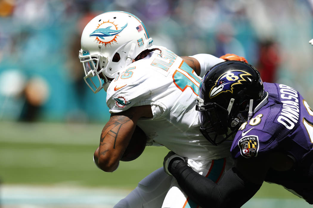 FILE - In this Sept. 8, 2019, file photo, Miami Dolphins wide receiver Albert Wilson (15) is ta ...