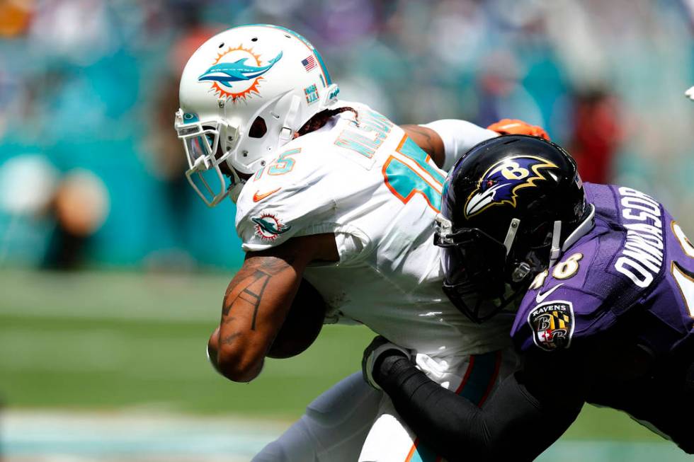 FILE - In this Sept. 8, 2019, file photo, Miami Dolphins wide receiver Albert Wilson (15) is ta ...