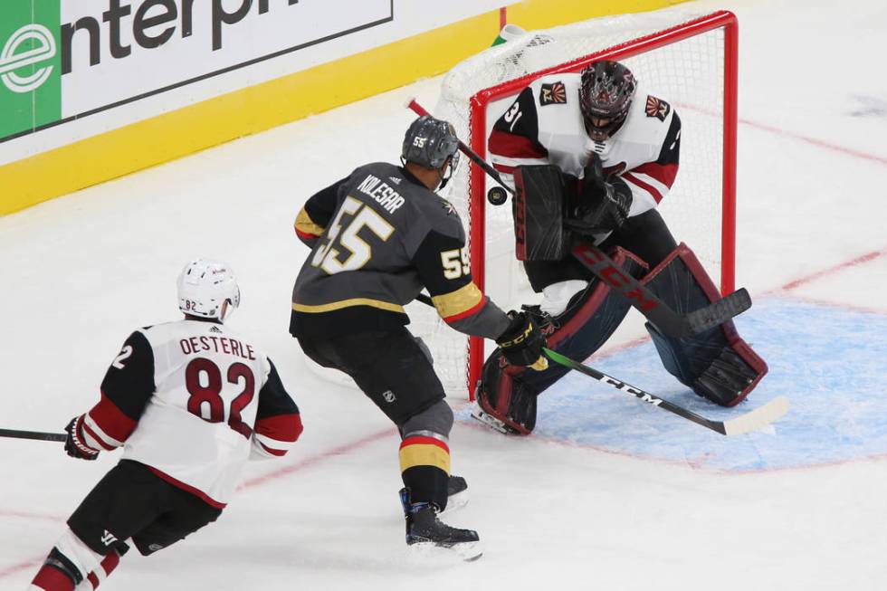 Vegas Golden Knights right wing Keegan Kolesar (55), under pressure from Arizona Coyotes defens ...