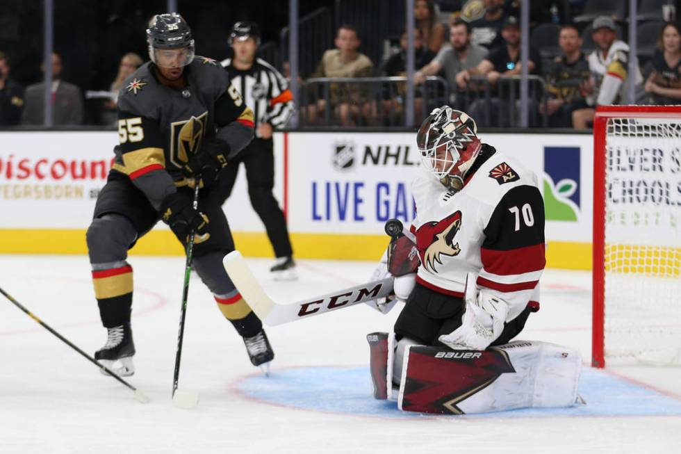 Arizona Coyotes goaltender Erik Kallgren (70) makes a stop as Vegas Golden Knights right wing K ...