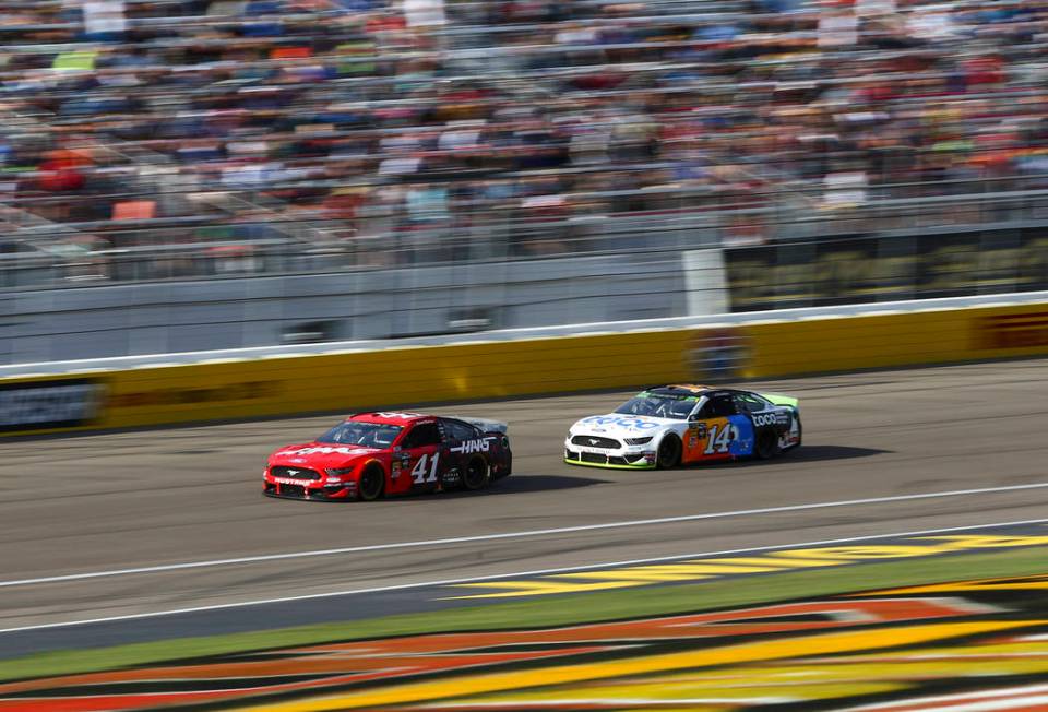 Daniel Suarez (41) and Clint Bowyer (14) drive during a NASCAR Cup Series auto race at Las Vega ...