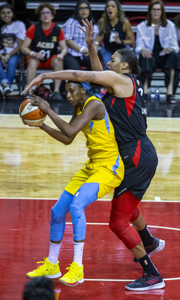 Chicago Sky center Astou Ndour (45) is defended well by Las Vegas Aces center Liz Cambage (8) d ...