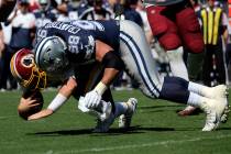 Dallas Cowboys defensive tackle Tyrone Crawford (98) sacks Washington Redskins quarterback Case ...
