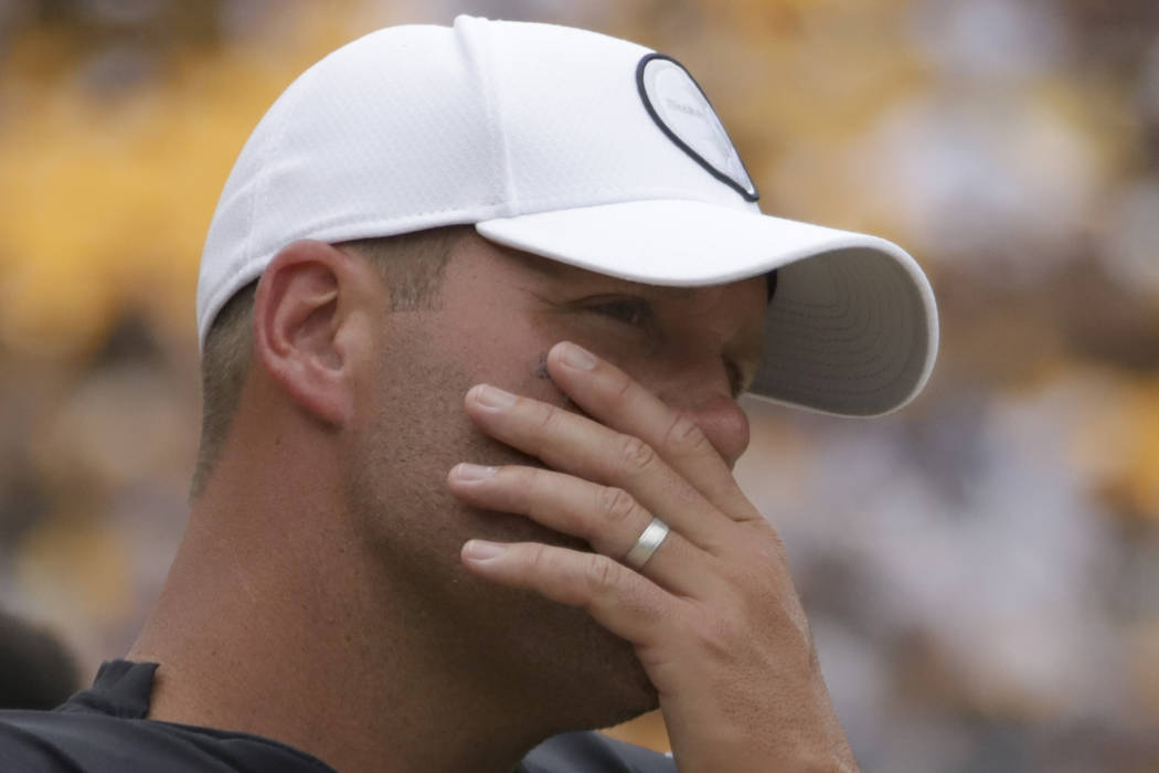 Pittsburgh Steelers quarterback Ben Roethlisberger stands on the sideline as the team plays aga ...